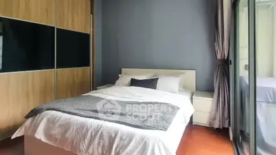 Modern bedroom with cozy bed and large wardrobe, featuring elegant decor and natural light.
