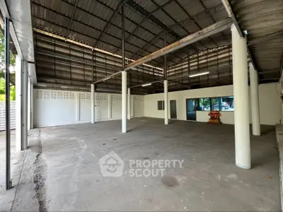 Spacious industrial warehouse with high ceilings and ample natural light