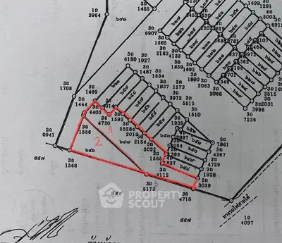 Detailed real estate plot map with numbered lots and boundaries.