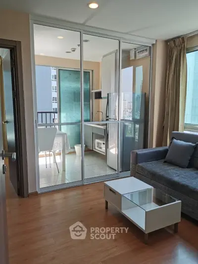 Modern apartment with glass-enclosed balcony and stylish living area