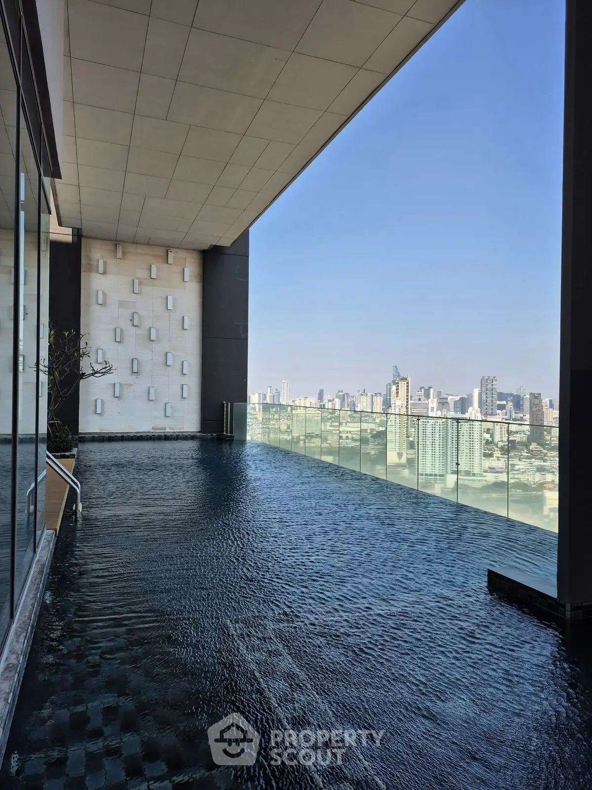 Luxurious rooftop infinity pool with stunning city skyline view