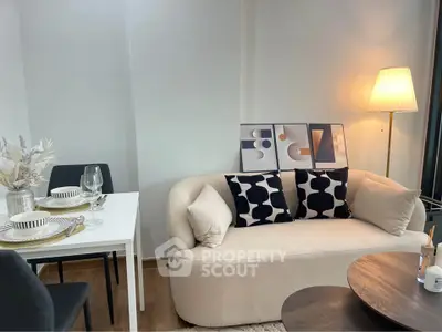 Stylish modern living room with cozy sofa and elegant dining area, perfect for urban living.