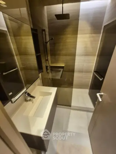 Modern bathroom with sleek design and rainfall showerhead