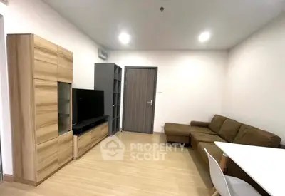 Modern living room with sleek furniture and wooden flooring