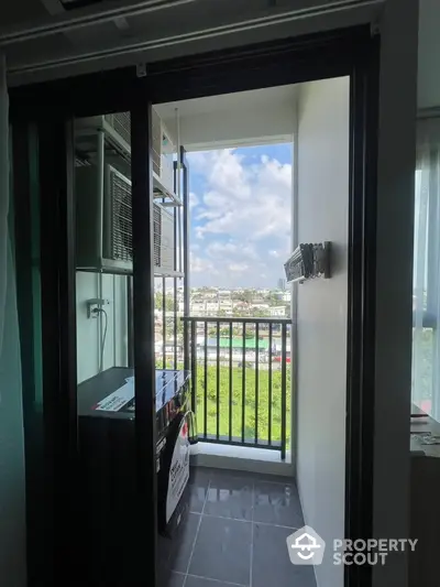 Compact balcony with laundry area and scenic city view