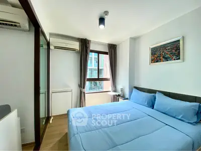 Bright and cozy bedroom with modern decor and large window view