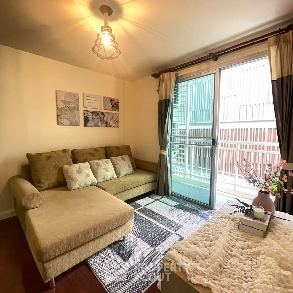 Cozy living room with stylish decor and large window for natural light
