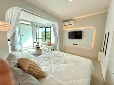 Luxurious bedroom with modern decor and balcony access