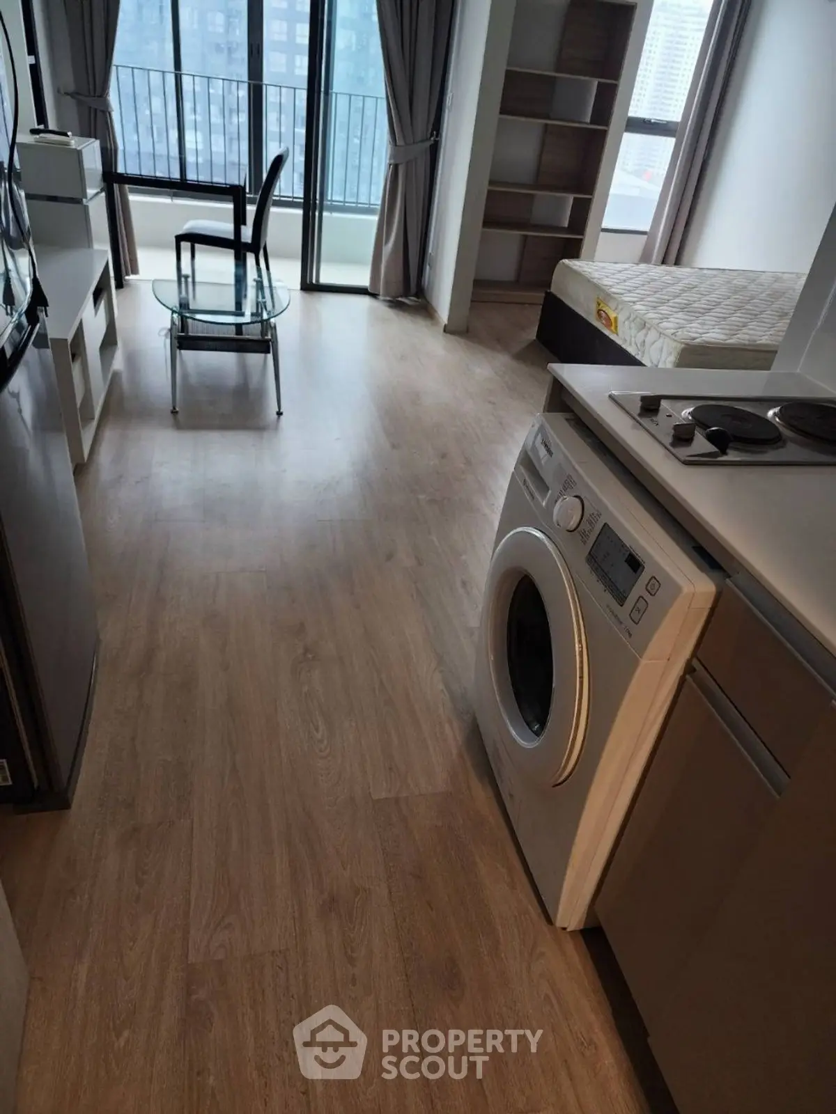 Modern studio apartment with washing machine and city view