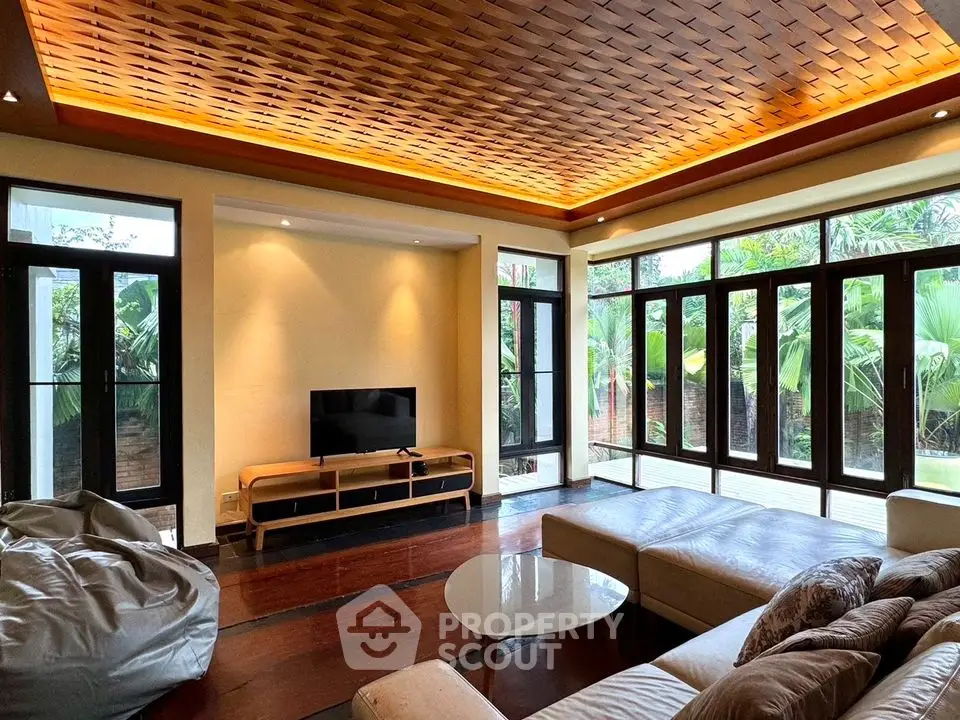 Luxurious living room with modern design and garden view