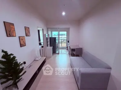 Modern living room with sleek furniture and balcony view