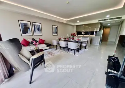 Luxurious open-plan living and dining area with modern decor and elegant furnishings.