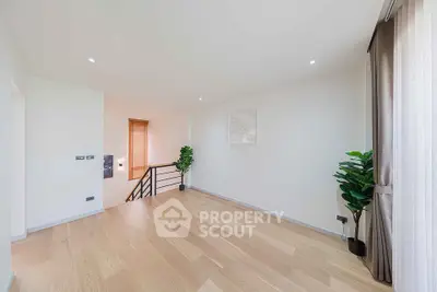 Spacious and bright interior with wooden flooring and modern decor