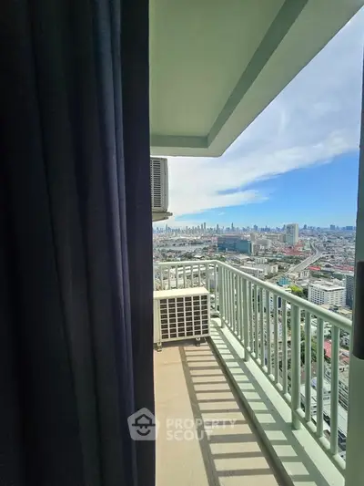 Stunning high-rise balcony with panoramic city views, perfect for urban living enthusiasts.