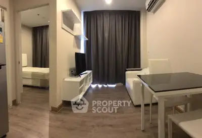 Modern living room with sleek furniture and natural light, perfect for urban living.