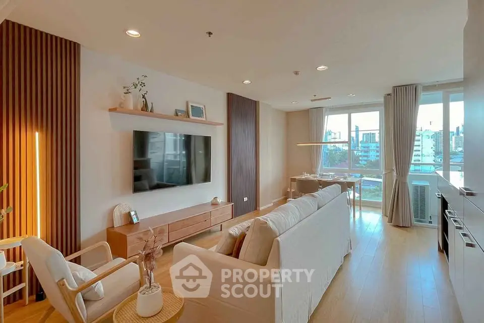 Spacious modern living room with large windows and stylish decor