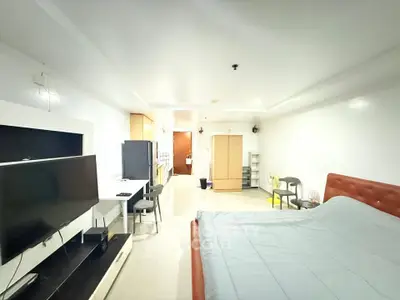Spacious studio apartment with modern furnishings and open layout