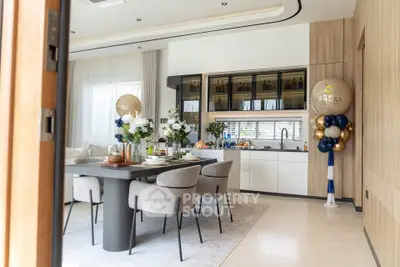 Luxurious modern kitchen with elegant dining area and stylish decor