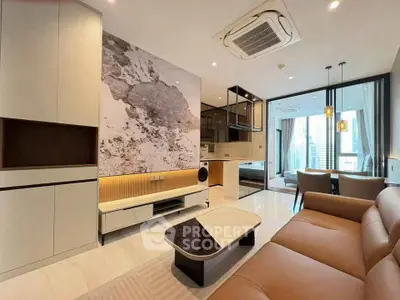 Modern living room with stylish decor and open kitchen layout in a luxury apartment.