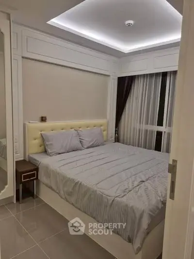 Modern bedroom with elegant lighting and cozy bed in stylish apartment.