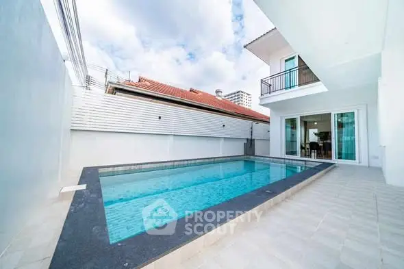 Stunning modern home with private swimming pool and spacious patio area.