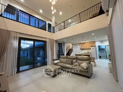 Spacious modern living room with high ceilings and open kitchen layout