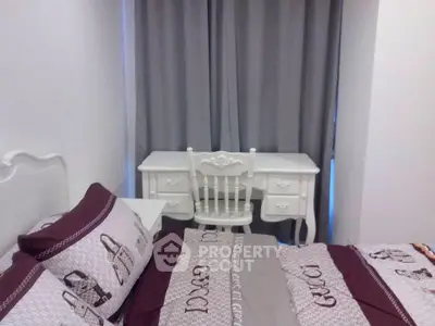 Cozy bedroom with elegant white desk and chair, complemented by stylish bedding and curtains.