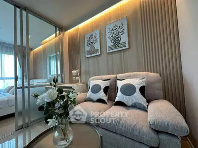 Modern living room with stylish decor and cozy seating area.