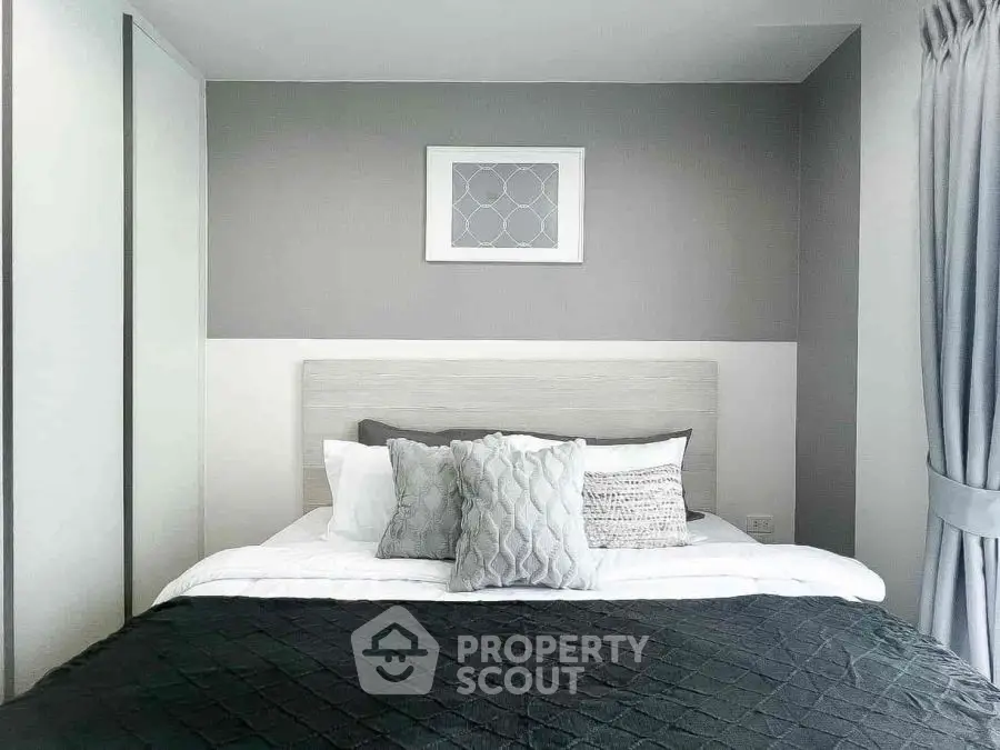 Modern bedroom with stylish decor and cozy bedding