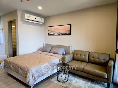 Modern bedroom with cozy sofa and stylish decor