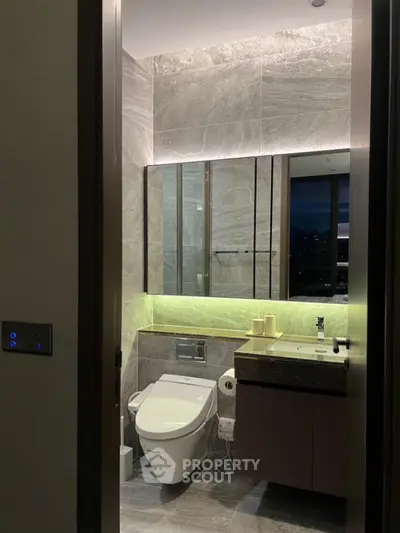Luxurious modern bathroom with sleek design and ambient lighting