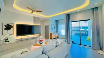 Luxurious living room with modern decor and large sliding doors to outdoor space.
