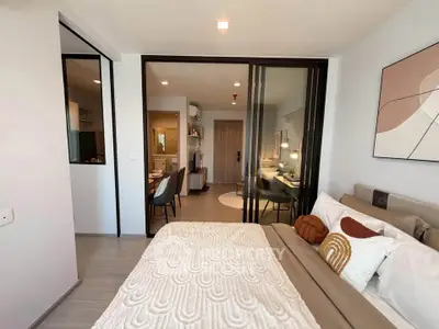 Modern bedroom with stylish decor and open view to living area