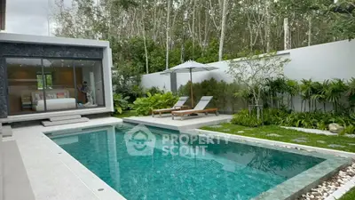 Luxurious modern villa with private pool and lush garden, perfect for relaxation and entertaining.