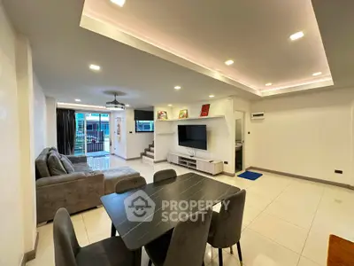 Spacious modern living room with open layout and stylish furniture, perfect for family gatherings.