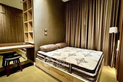 Luxurious bedroom with elegant decor and cozy ambiance, featuring a comfortable bed and stylish furnishings.