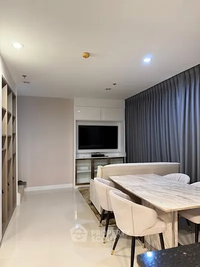 Modern living room with elegant dining area and stylish decor