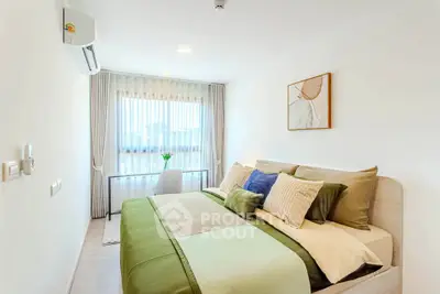Bright and cozy bedroom with modern decor and large window view
