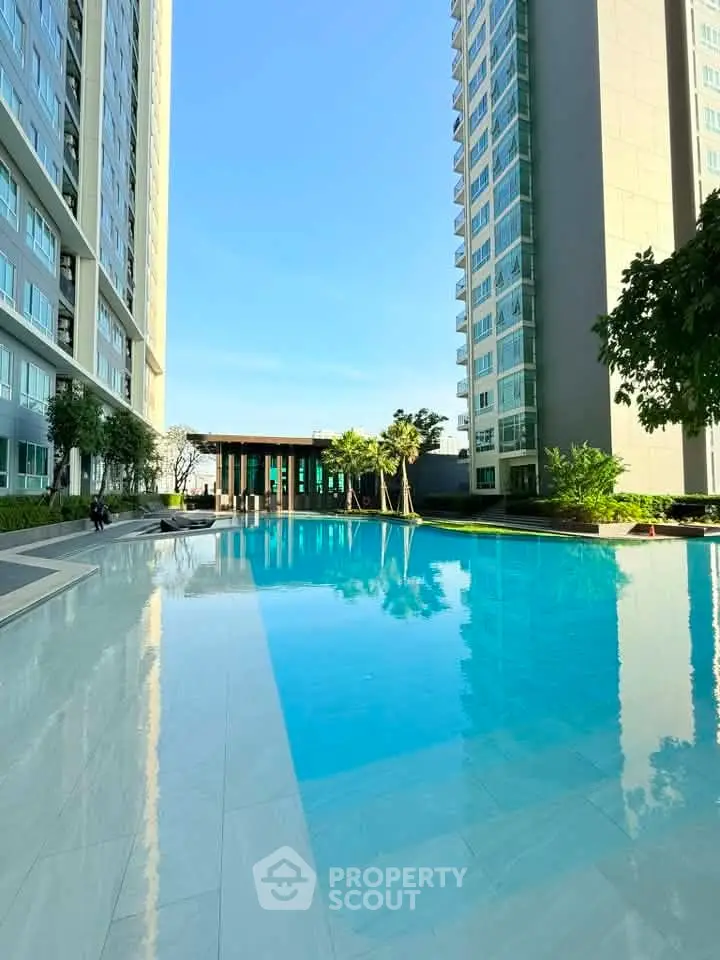 Luxurious high-rise apartment with stunning pool and modern architecture.