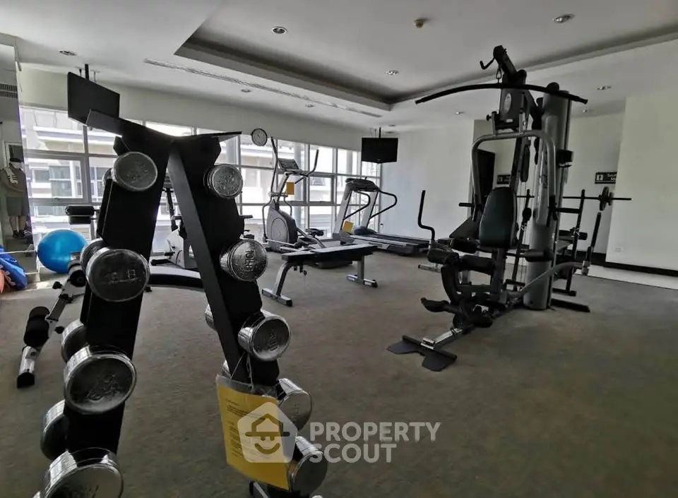 Modern gym with state-of-the-art equipment in a residential building.