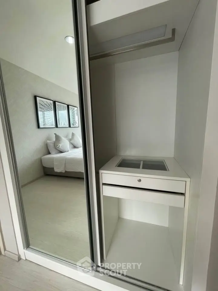 Modern bedroom with sleek built-in wardrobe and stylish decor