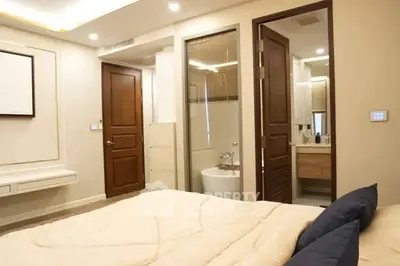 Modern bedroom with ensuite bathroom and cozy decor