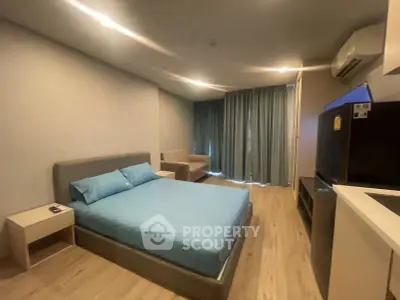 Modern bedroom with stylish decor and cozy ambiance in a contemporary apartment.