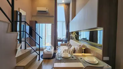 Modern duplex apartment with stylish living area and dining space, featuring high ceilings and large windows.