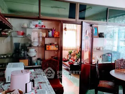 Charming kitchen with open layout and cozy dining area, perfect for family gatherings.