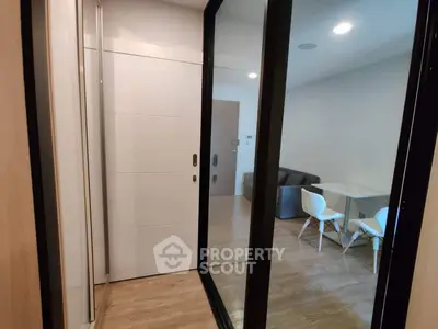 Modern apartment interior with sliding glass doors and cozy dining area.