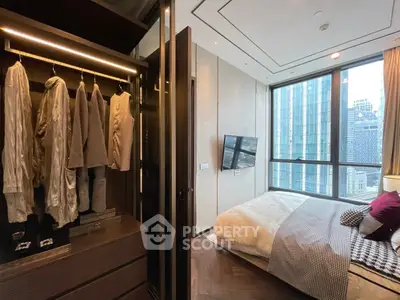 Luxurious bedroom with city view and walk-in closet in modern high-rise apartment.