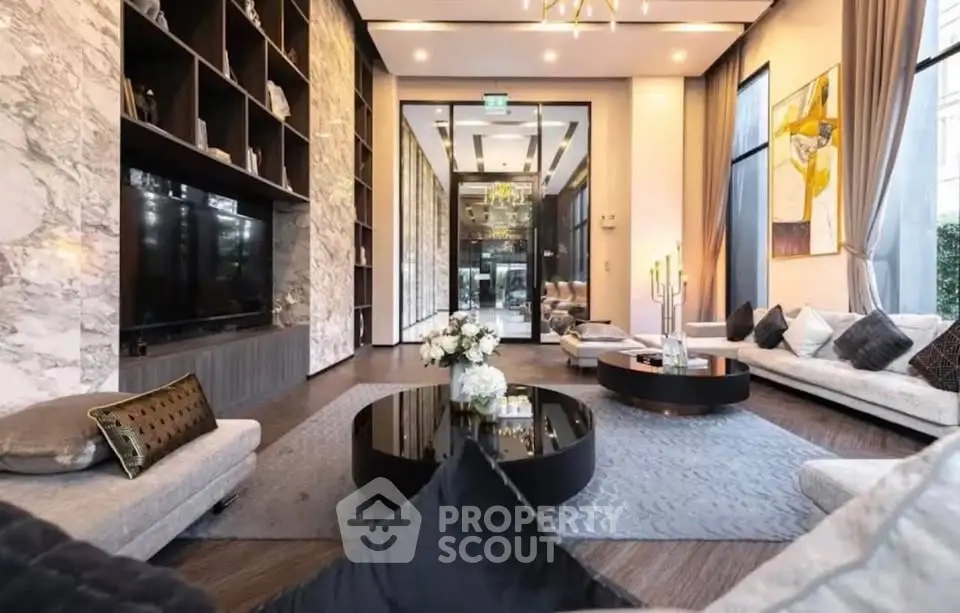 Luxurious modern living room with elegant decor and spacious seating area.