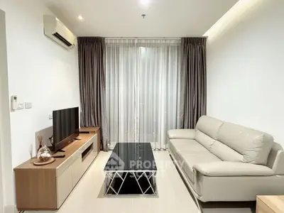 Modern living room with sleek furniture and natural light