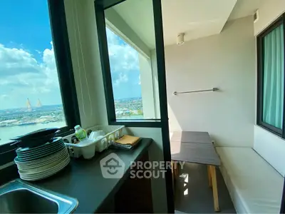 Charming balcony with stunning city view, perfect for relaxation and dining, featuring a cozy seating area.